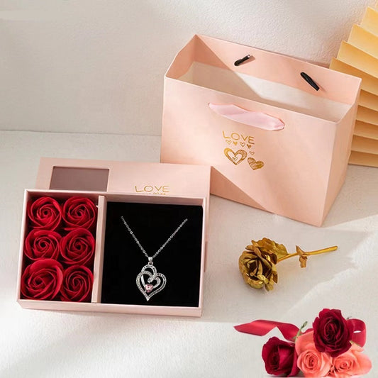 Boîte de roses éternelles avec son collier "Je t'aime en 100 langues"